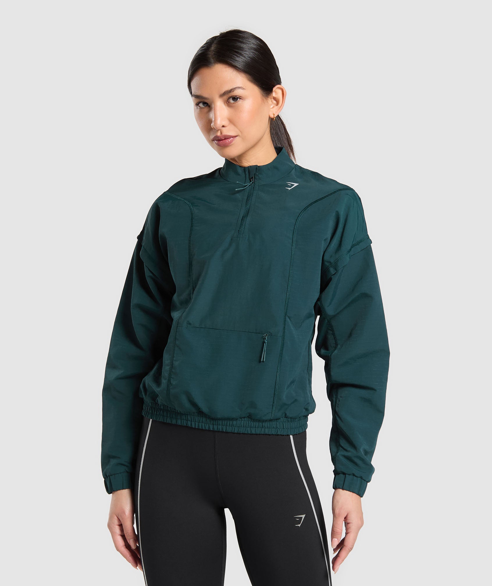 Top deportivo con cremallera de 1/4 para correr