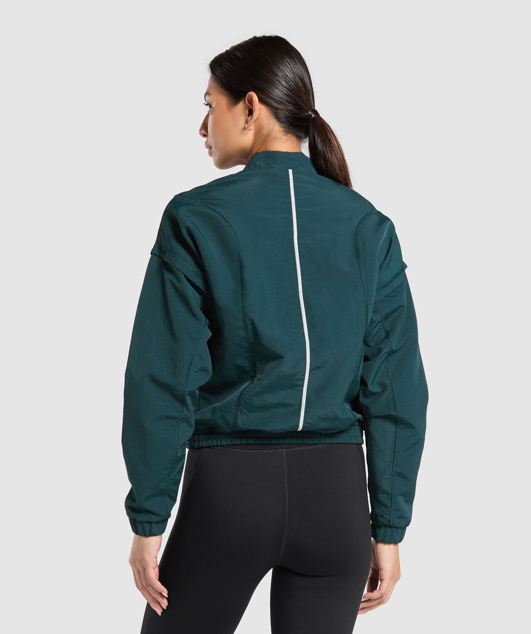 Top deportivo con cremallera de 1/4 para correr