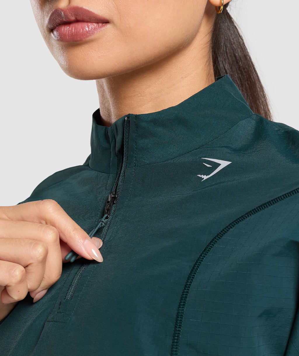 Top deportivo con cremallera de 1/4 para correr